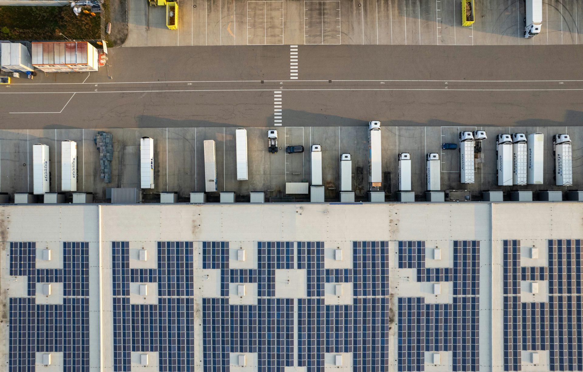 An aerial view of a parking lot with cars